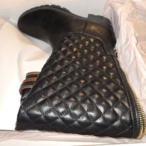 Black boots with brown trim